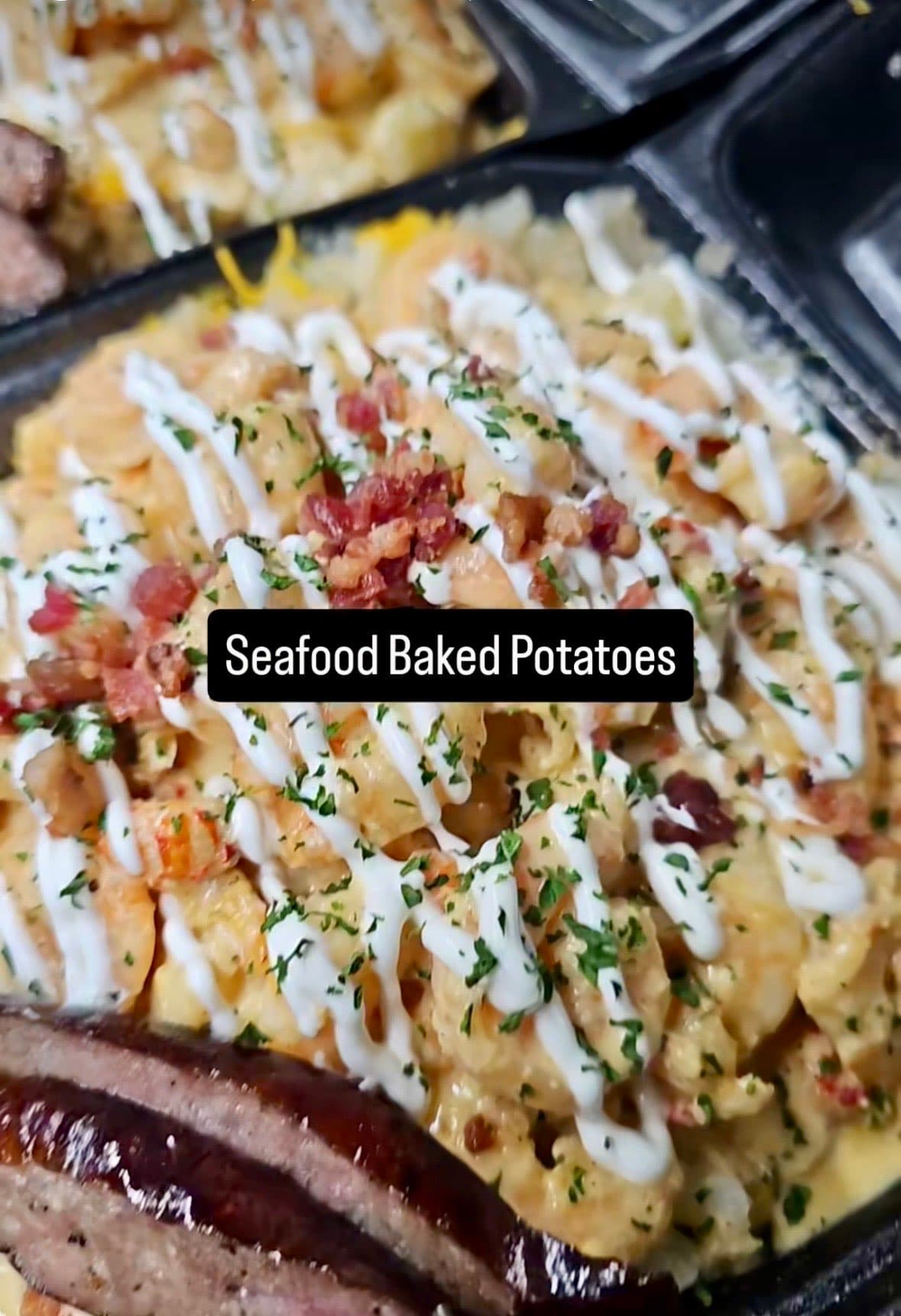 Seafood baked potato loaded with crawfish, shrimp, sour cream, and bacon bits — Lil Moe's Potato Trap Houston catering