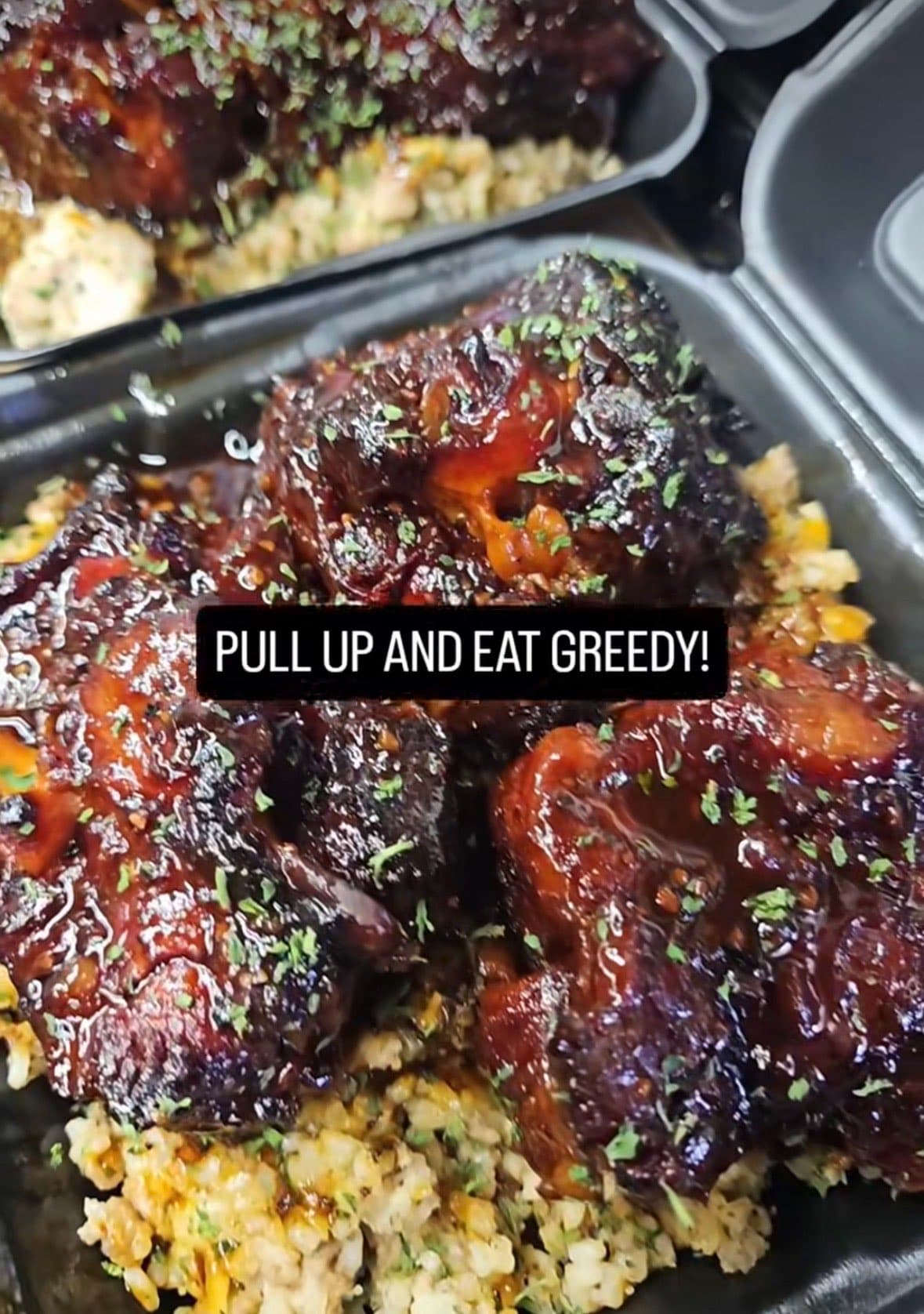 BBQ glazed chicken and ribs over seasoned dirty rice — Lil Moe's Potato Trap Houston food truck catering